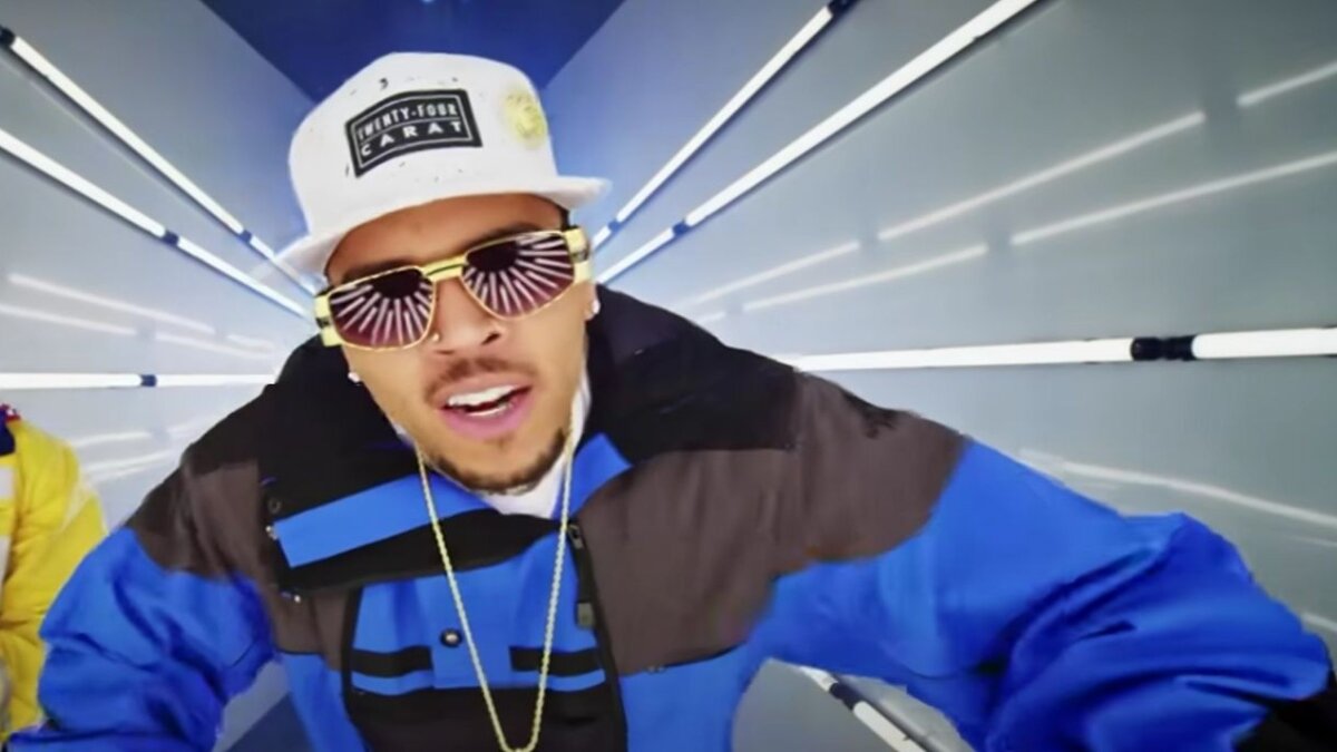 Why is Chris Brown suing Warner Bros for USD 500 Million?
